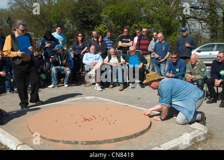 World Champion Marbles Championship, Good Friday, Tinsley Green, Sussex UK. Played outside the Greyhound pub. 2012 2010s UK HOMER SYKES Stock Photo