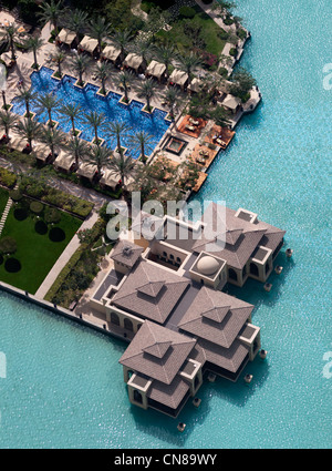 An overview of hotel 'The Palace The Old Town Dubai' in Downtown Dubai area (the United Arab Emirates). The swimming pool. Stock Photo