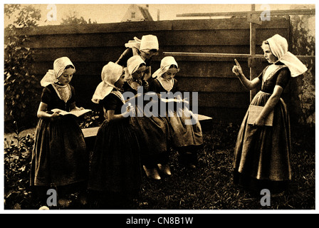 First published 1914  Dutch School girl  uniform Holland Zuider Zee Stock Photo