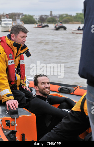 Protester against elitism Trenton Oldfield in RNLI rib looking smug after stopping the 158 th Oxford verses Cambridge Boat Race Stock Photo