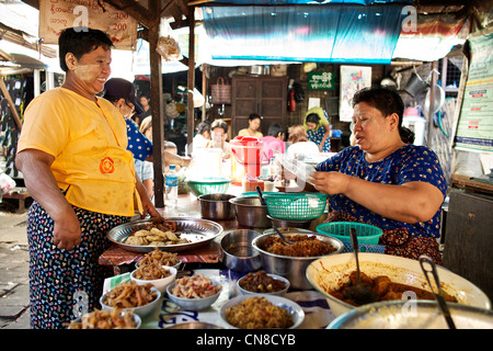 A Burmese woman sells food on the streets of Yangon (Rangon), Myanmar (Burma) Stock Photo