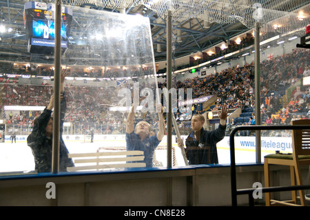 Nottingham Arena staff replacing plexi glass before the first semi final of the Elite Ice Hockey League Playoffs Stock Photo
