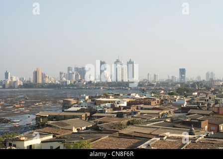 Urbanization Contrast - Slums in the foreground and high rises behind - Mumbai, India Stock Photo