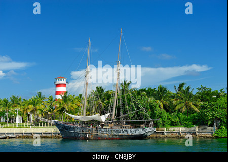 Bahamas, Grand Bahama Island, Freeport, Port Lucaya, Ghost, boat of Pirates of the Caribbean movie with a lighthouse in Stock Photo