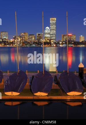 Docked boats against the cityscape of Back Bay Boston, Massachusetts, USA from across the Charles River.