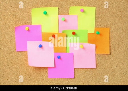 Adhesive Note Papers on Cork Board Stock Photo