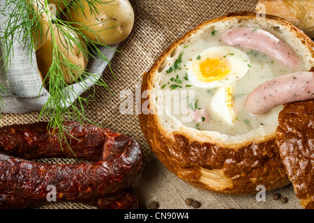 Closeup hot soup served in bread on Easter Stock Photo