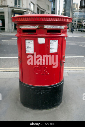 Red Royal Mailbox on street of London Stock Photo