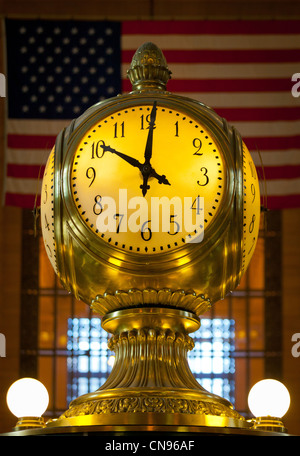 Clock and flag in the Main Concourse of New York City's Grand Central Terminal Stock Photo