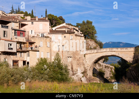 France, Vaucluse, Vaison la Romaine, Roman bridge over Ouveze River dating 1st century AD, Mount Ventoux in the background Stock Photo