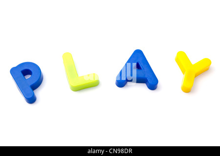 Letter magnets ' play' closeup on white background Stock Photo