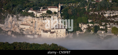 France, Lot, Rocamadour, Aerial view of the city and its religious shrines dominated by its castle in the Canyon of the Alzou Stock Photo