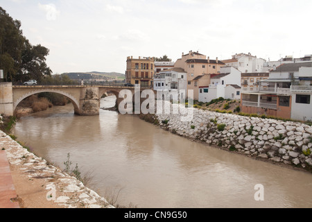 Puente Genil river bridged Cordoba Spain village monument Andalucia water tourism home sud Stock Photo