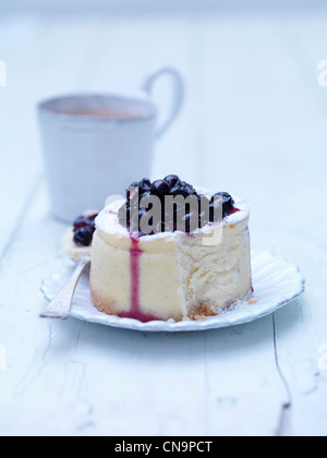 Plate of blackcurrant cheesecake Stock Photo