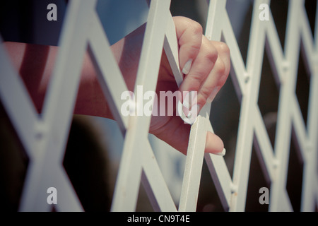hand grabbing bars Stock Photo: 9677275 - Alamy