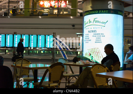 Silhouette of a man in a cafe at the Denver International Airport, Denver, Colorado, USA Stock Photo