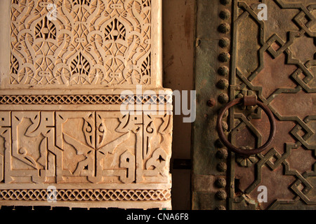 Detail of stucc and carved wood door at the entrance to Ali Ben Youssef Medersa/Madrassah in Marrakech, Morocco, north Africa Stock Photo