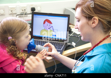 A young girl undergoes a spirometry lung function test UK Stock Photo