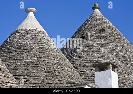 Italy, Puglia, Bari province, Alberobello, trulli borrough (old dry stone buildings with slate roof), listed as Wolrd Heritage Stock Photo