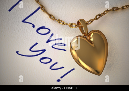 Gold heart pendant on a white paper with the type I love you, hand written on it. Stock Photo