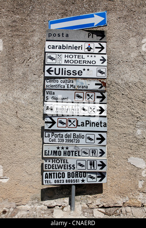 Signpost with street and hotels signs with directions in Erice, Sicily, Italy Stock Photo