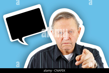 Old grumpy senior man pointing you with fun cartoon black speech bubble for your text Stock Photo