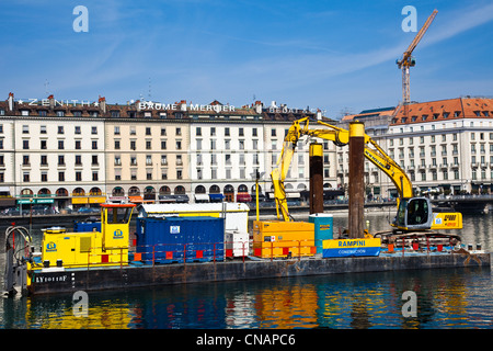 Barge containing construction equipment on the River Rhone in Geneva, Switzerland Stock Photo