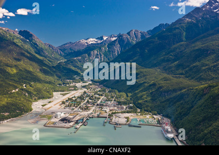 Aerial view of the city of Skagway with a cruise ship docked at port, Southeast Alaska, Summer Stock Photo