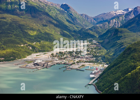 Aerial view of the city of Skagway with a cruise ship docked at port, Southeast Alaska, Summer Stock Photo