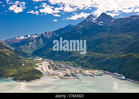 Aerial view of the city of Skagway with a cruise ship docked at port, Southeast Alaska, Summer Stock Photo