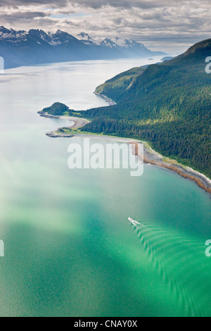 Aerial view of a commercial fishing boat heading down Chilkoot Inlet, Haines, Southeast Alaska, Summer Stock Photo