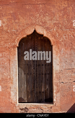 Ornate window in sand wall Stock Photo