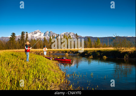 Father and sun kayak to their to Rabbit Slough in the Palmer Haystack Flats wildlife refuge, Matanuska-Susitna Valley, Alaska Stock Photo