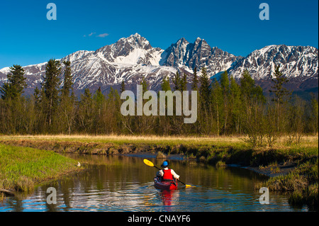 A man kayaking on Rabbit Slough in Palmer Haystack Flats Wildlife Refuge, Matanuska-Susitna Valley, Alaska Stock Photo