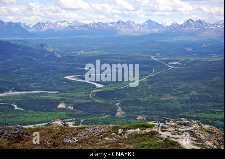 Hikers view the Parks Highway and the Nenana River from the Mt. Healy Overlook Trail in Denali National Park & Preserve, Alaska Stock Photo