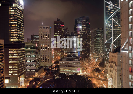 Urban skyscrapers lit up at night Stock Photo