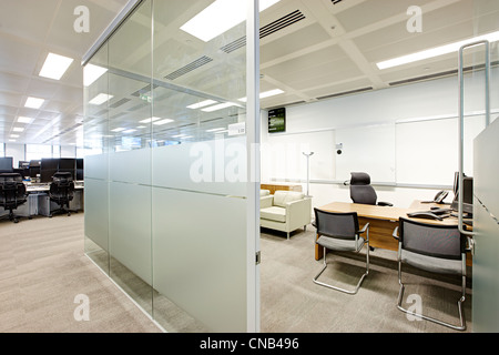 office trading floor supervisor glass wall meeting Stock Photo