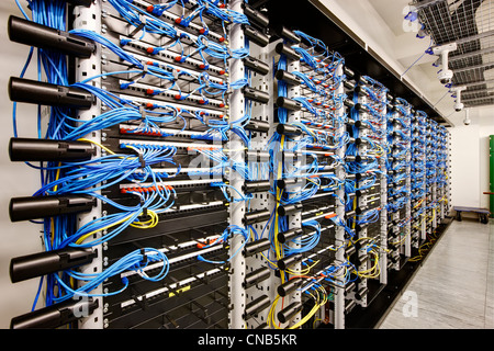 wall of network cabling blue bank computer room Stock Photo