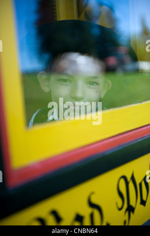 Boy looking out of a horse-drawn carriage on the traditional Rosstag day, St. Maergen, Germany Stock Photo