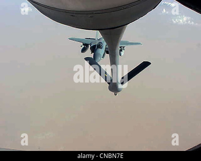 An F-15 Eagle moves in to be refueled by a KC-135R Stratotanker from the 319th Air Refueling Wing of Grand Forks Air Force Base, N.D., on April 12 , 2012 over the Central United States. Stock Photo