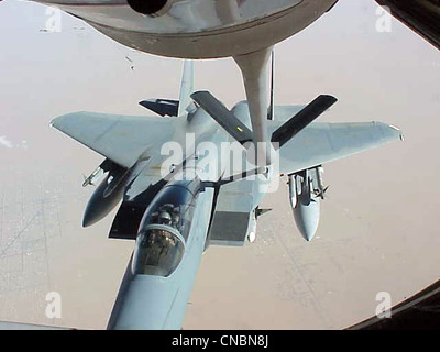 An F-15 Eagle moves in to be refueled by a KC-135R Stratotanker from the 319th Air Refueling Wing of Grand Forks Air Force Base, N.D., on April 12 , 2012 over the Central United States. Stock Photo