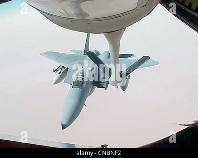 An F-15 Eagle moves in to be refueled by a KC-135R Stratotanker from the 319th Air Refueling Wing of Grand Forks Air Force Base, N.D., on April 12 , 2012 over the Central United States. Stock Photo