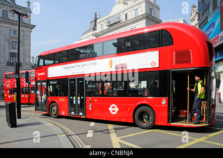 Passenger standing on open rear platform of New 2012 London bus variously referred to as a Routemaster or Boris bus Stock Photo