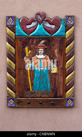 The Santo Niño de Atocha, a Roman Catholic image of the Child Jesus, outside of a church in Chimayo, New Mexico. Stock Photo