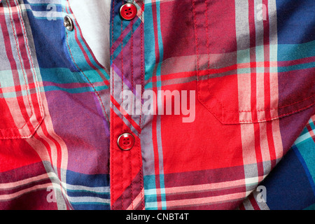 Close up detail of a red plaid button up style shirt. Stock Photo