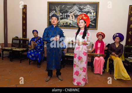 Vietnamese ladies in traditional Vietnamese ao dia on Street life Ho Chi  Minh (Saigon) Vietnam Stock Photo - Alamy