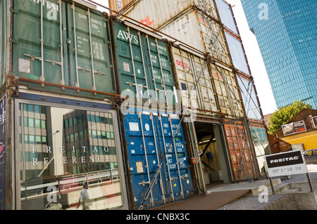 Horizontal streetview of the unusual Freitag Tower made purely of recycled freight containers in central Zurich on a sunny day Stock Photo