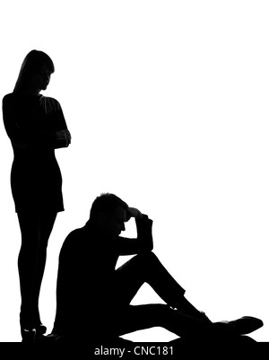 one caucasian couple man and woman dispute conflict full length in studio silhouette isolated on white background Stock Photo