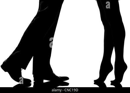 one caucasian detail legs feet couple man and woman tiptoe lovers teenderness in studio silhouette isolated on white background Stock Photo