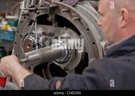 Engineer repairing heavy mechanical equipment Stock Photo